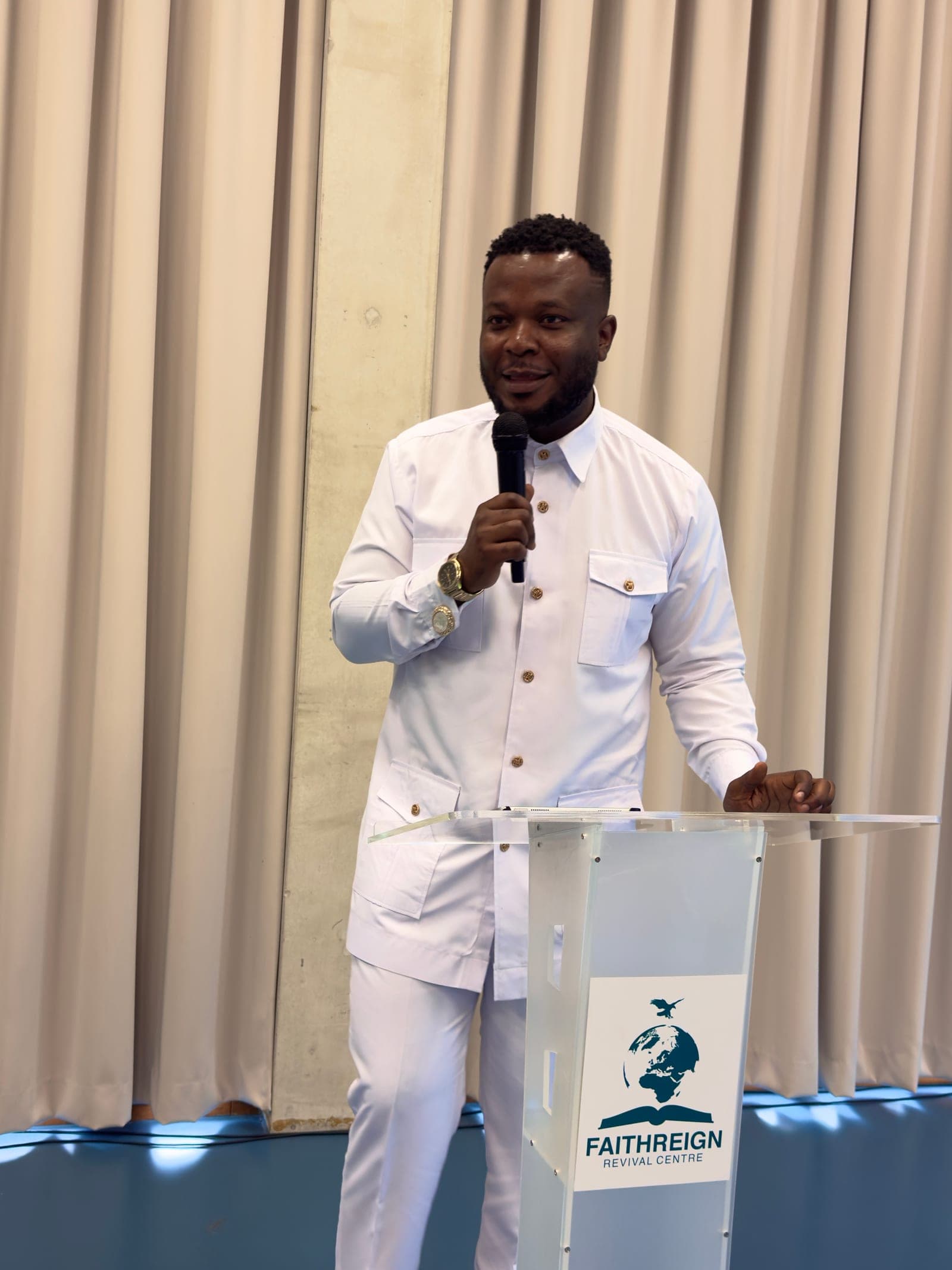 Prophet Abraham Faithman speaking from the FaithReign pulpit